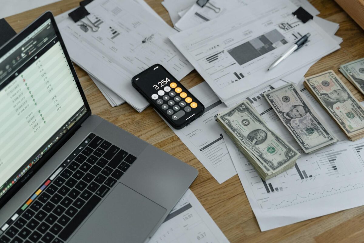 How to Budget - banknotes and calculator on table