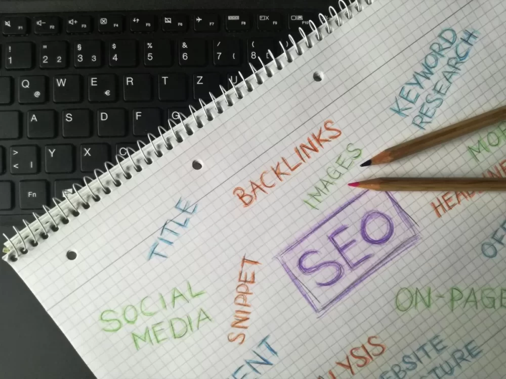 Search Engine Optimization (SEO) - scribbled notes on a computer keyboard